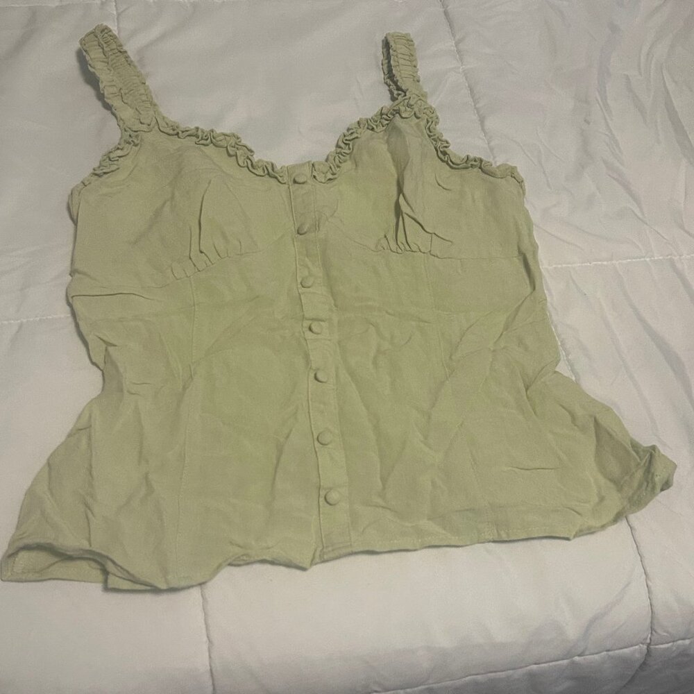 Coffee Bean sage green button-up cami crop top with ruffled straps.